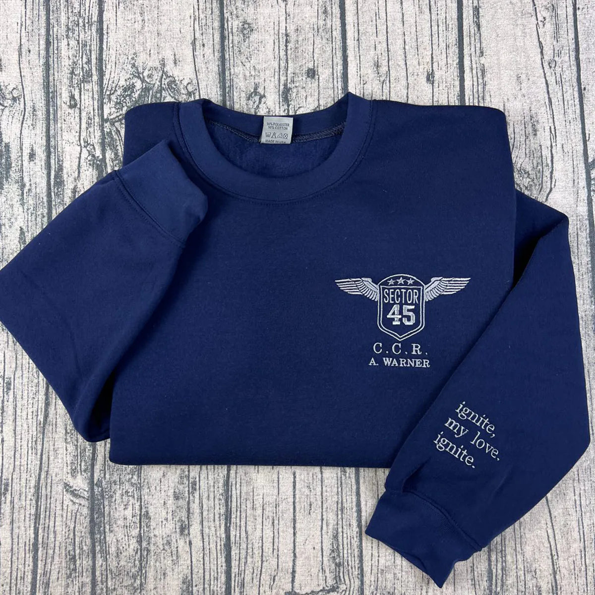 A Warner sweatshirt inspired by the Shatter Me series, custom embroidery for book lover apparel fans.
