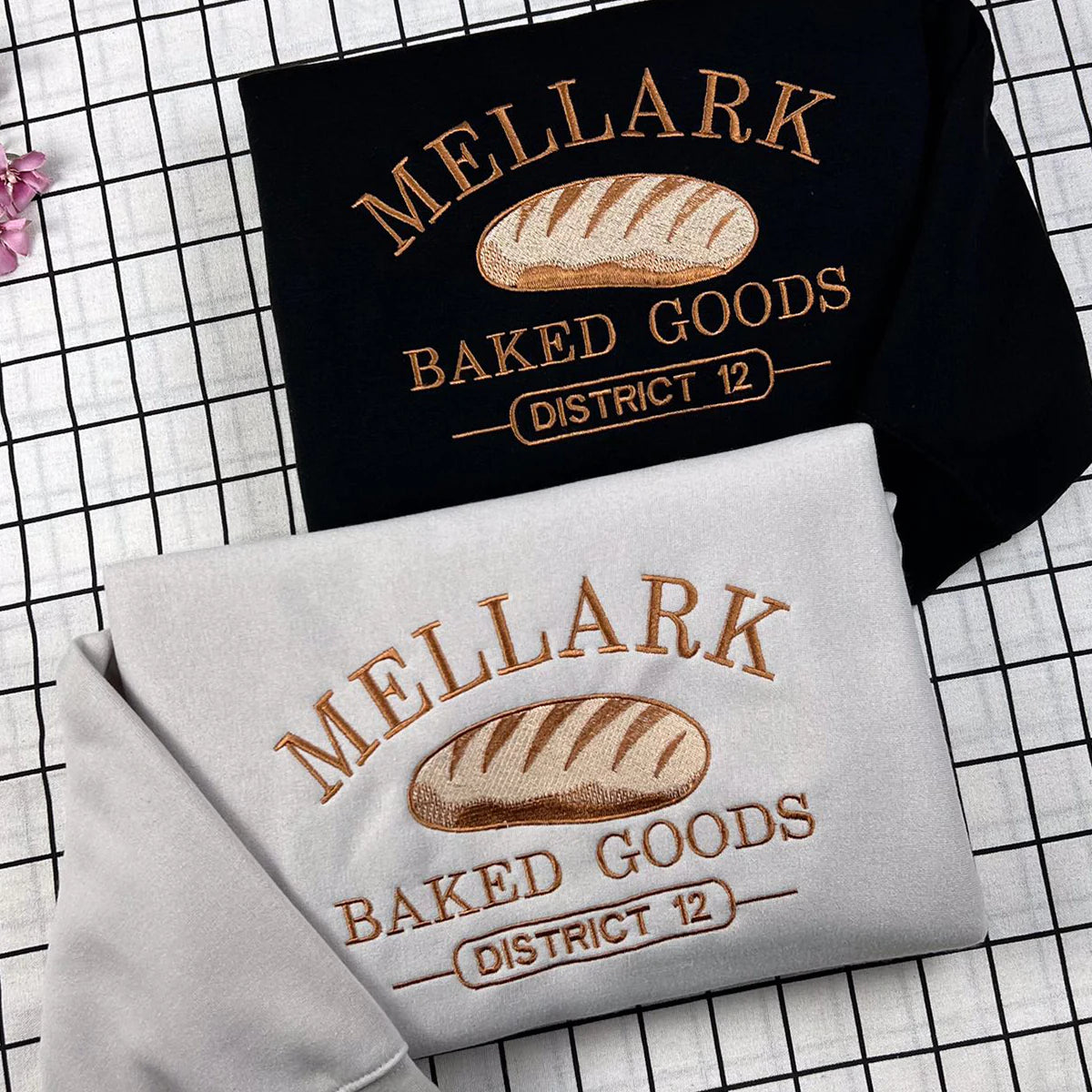 Embroidered Mellark Baked Good Sweatshirt, Hunger Games Inspired Hoodie featuring Abanathy Liquors design, perfect for bookish fans.