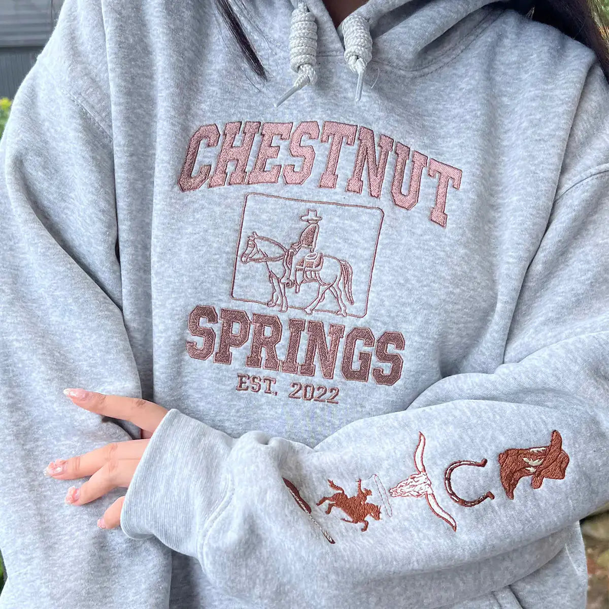 Gray hoodie with 'Chestnut Springs' text and horse graphics