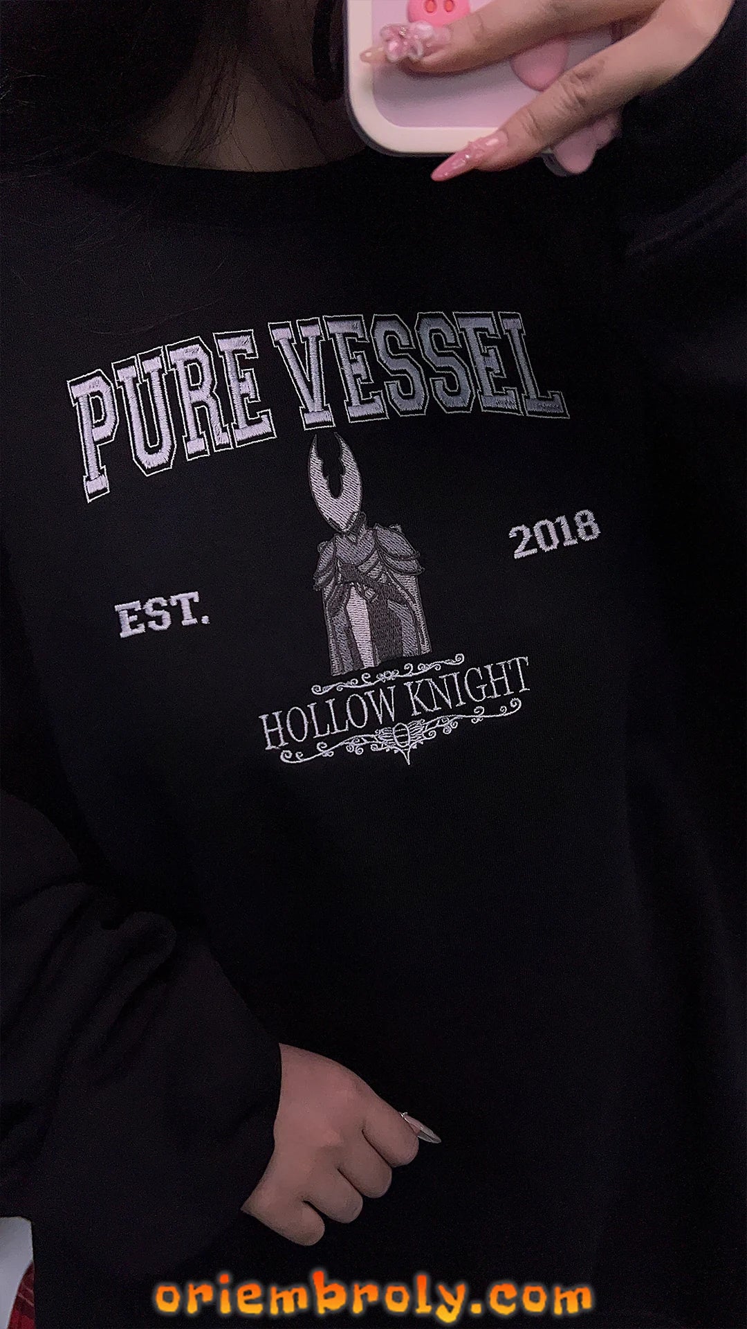 Detailed embroidery on Pure Vessel-inspired sweatshirt