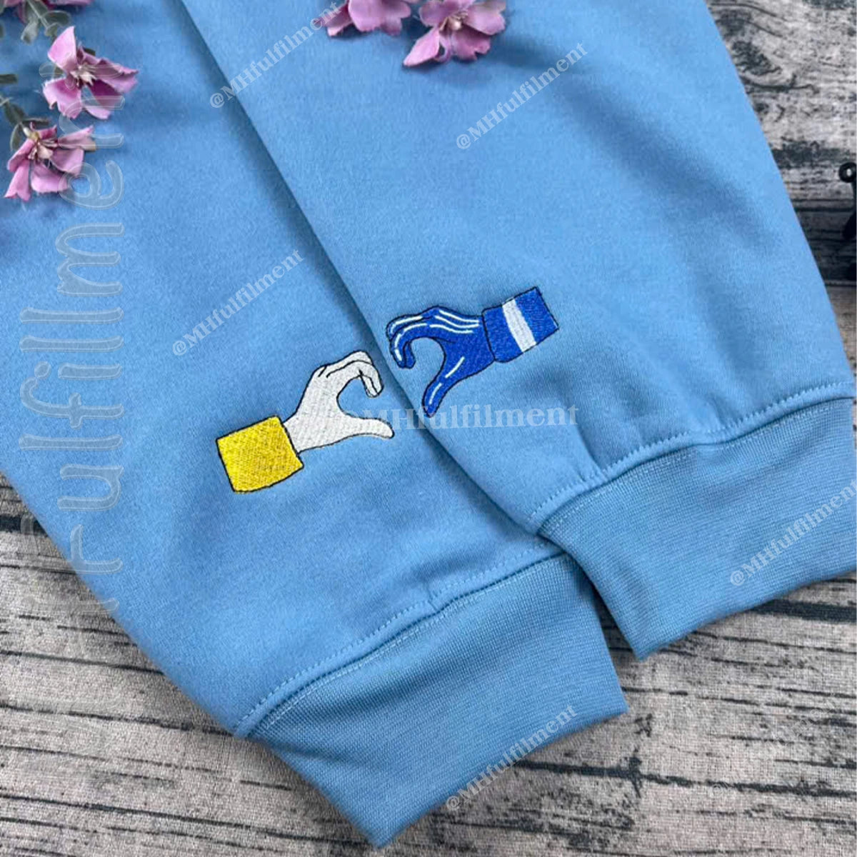 Matching Halloween hoodies featuring Coraline and Wybie embroidery