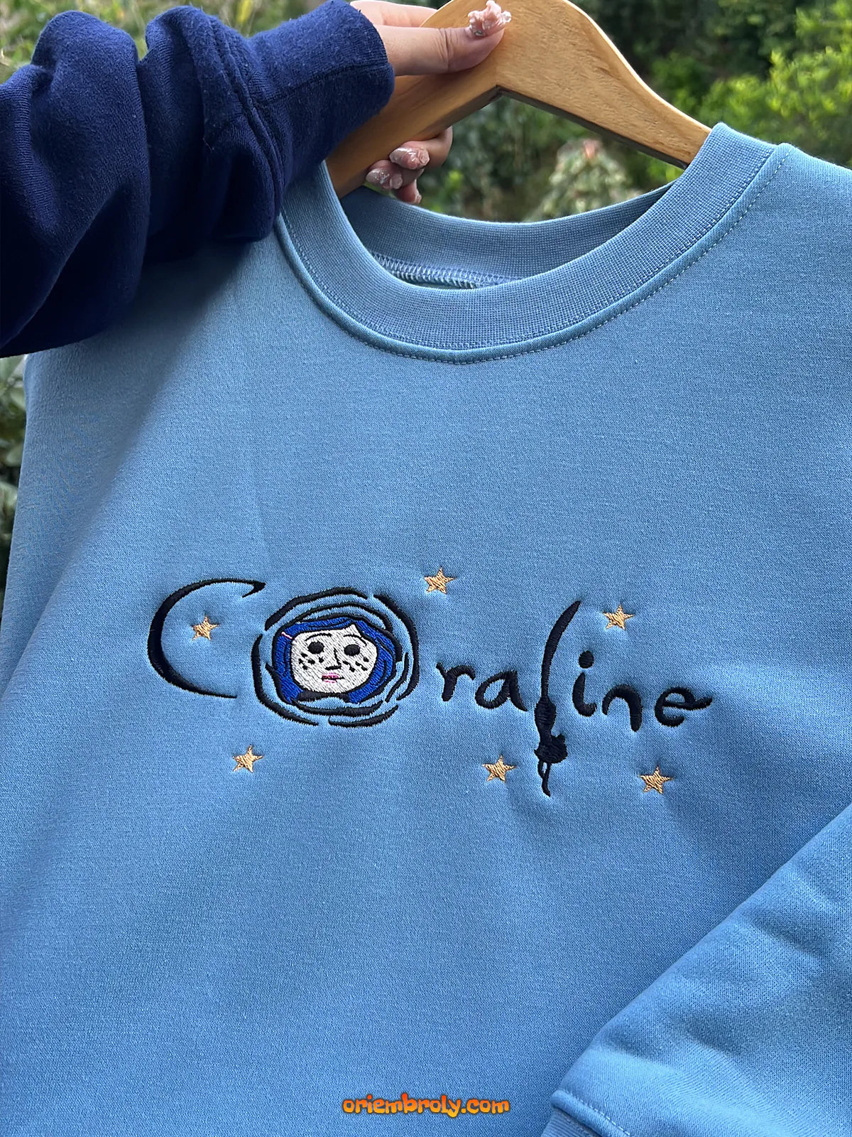 Embroidered Coraline hoodie design