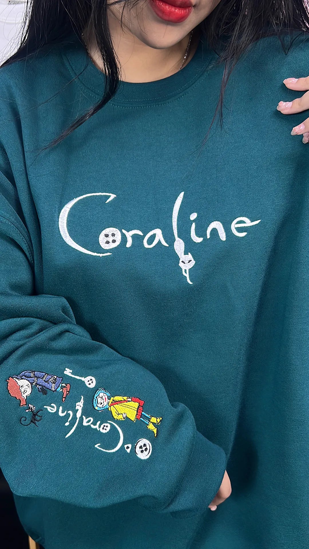 Cozy Coraline & Wybie crewneck sweater for fall and autumn wear.