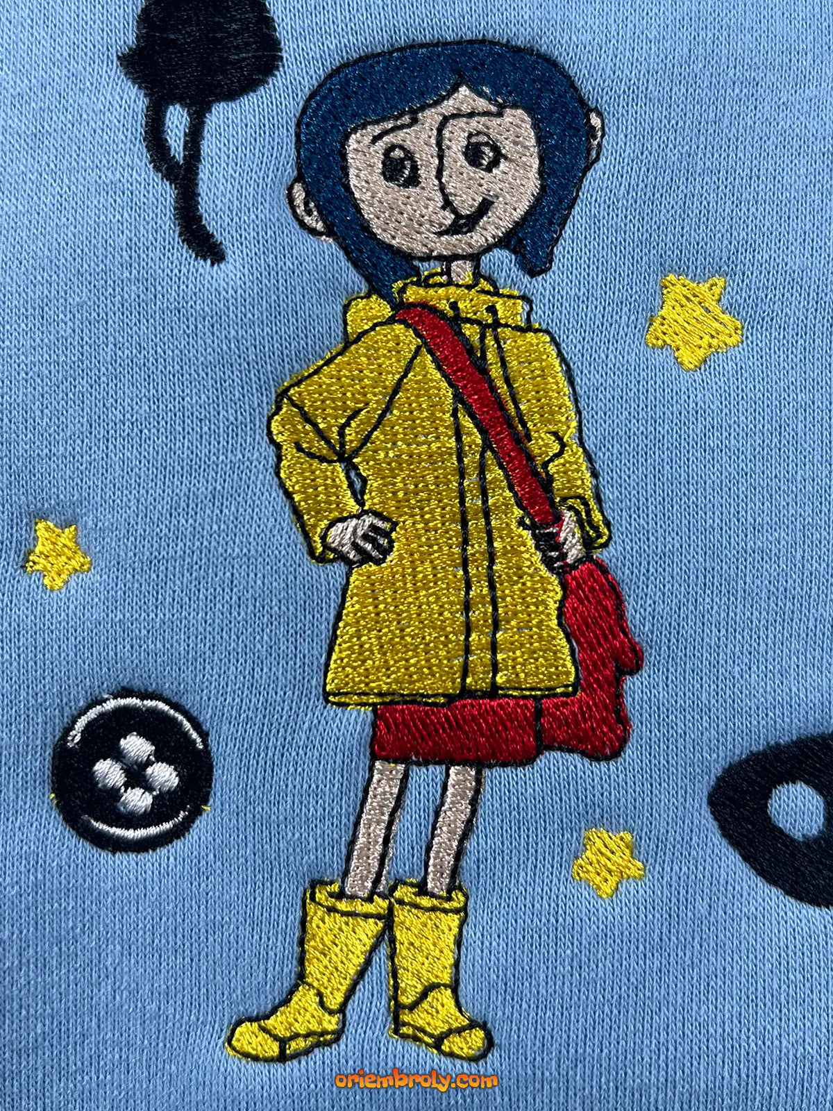 Cozy Coraline button eye pullover
