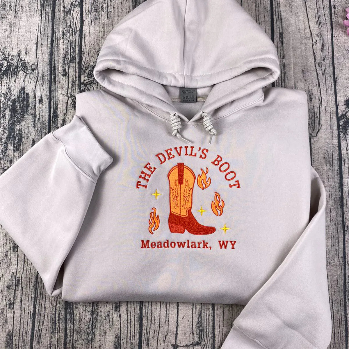 Done and Dusted sweatshirt featuring licensed Lyla Sage cowboy romance book merch embroidery.