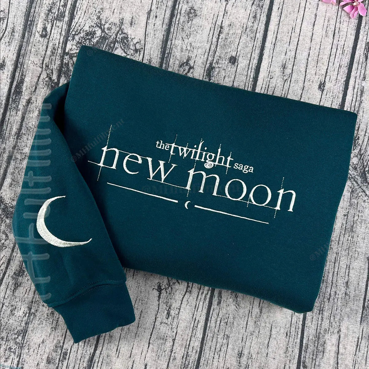 Embroidered New Moon design on black crewneck
