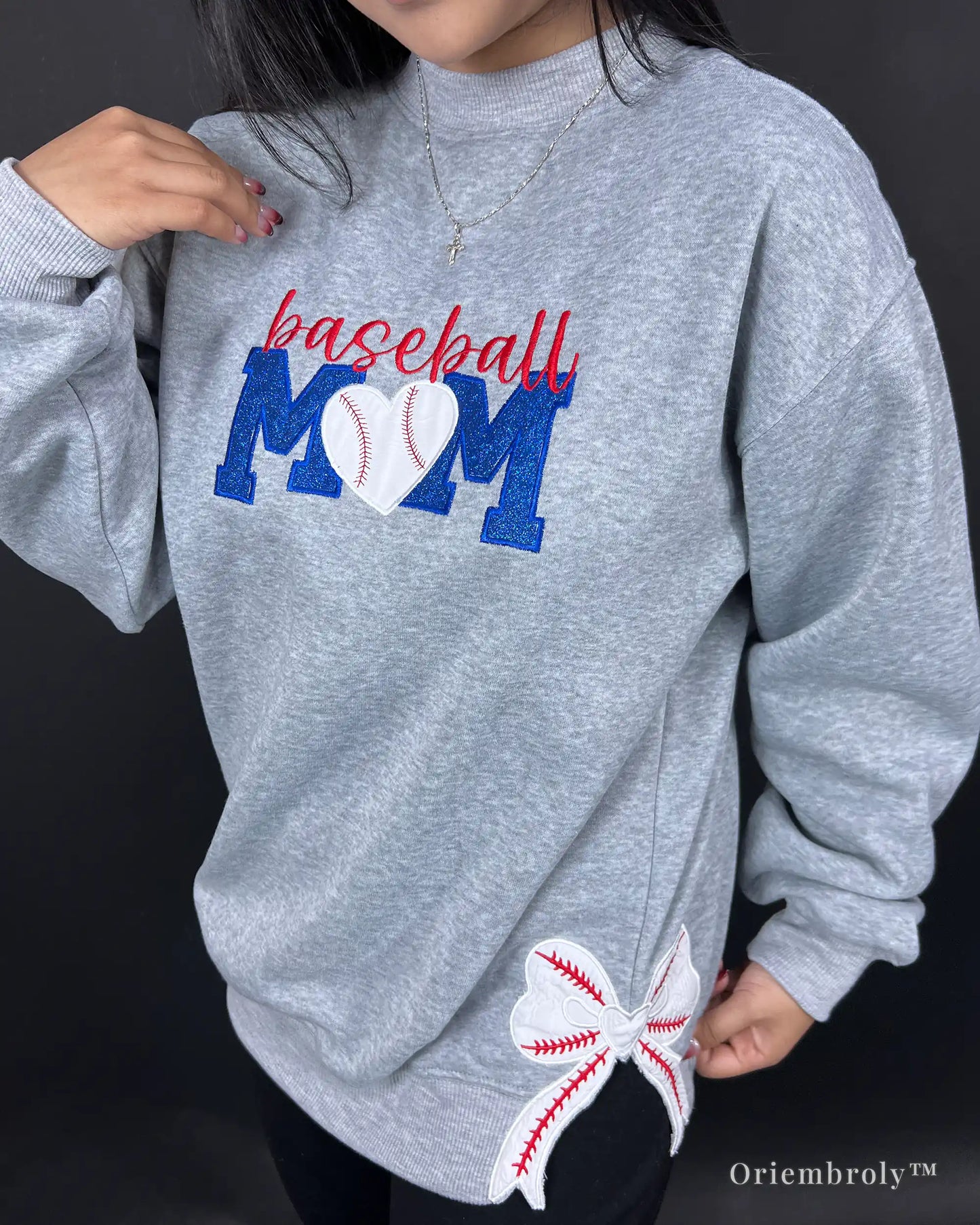 red cursive baseball lettering layered over blue block embroidery