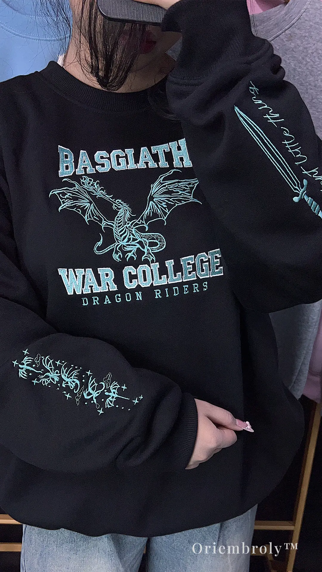 model wearing fantasy dragon embroidered crewneck