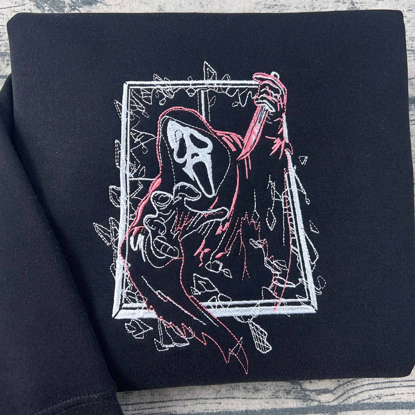 Ghostface embroidered hoodie β cozy Halloween horror sweatshirt, perfect for spooky season and scary movie fans