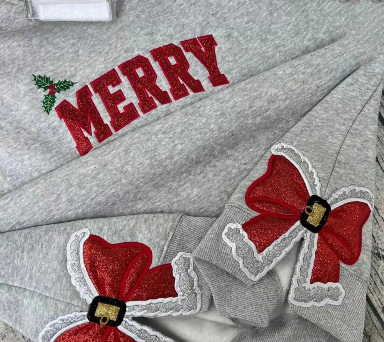 Glitter applique Christmas shirt with festive embroidery detail