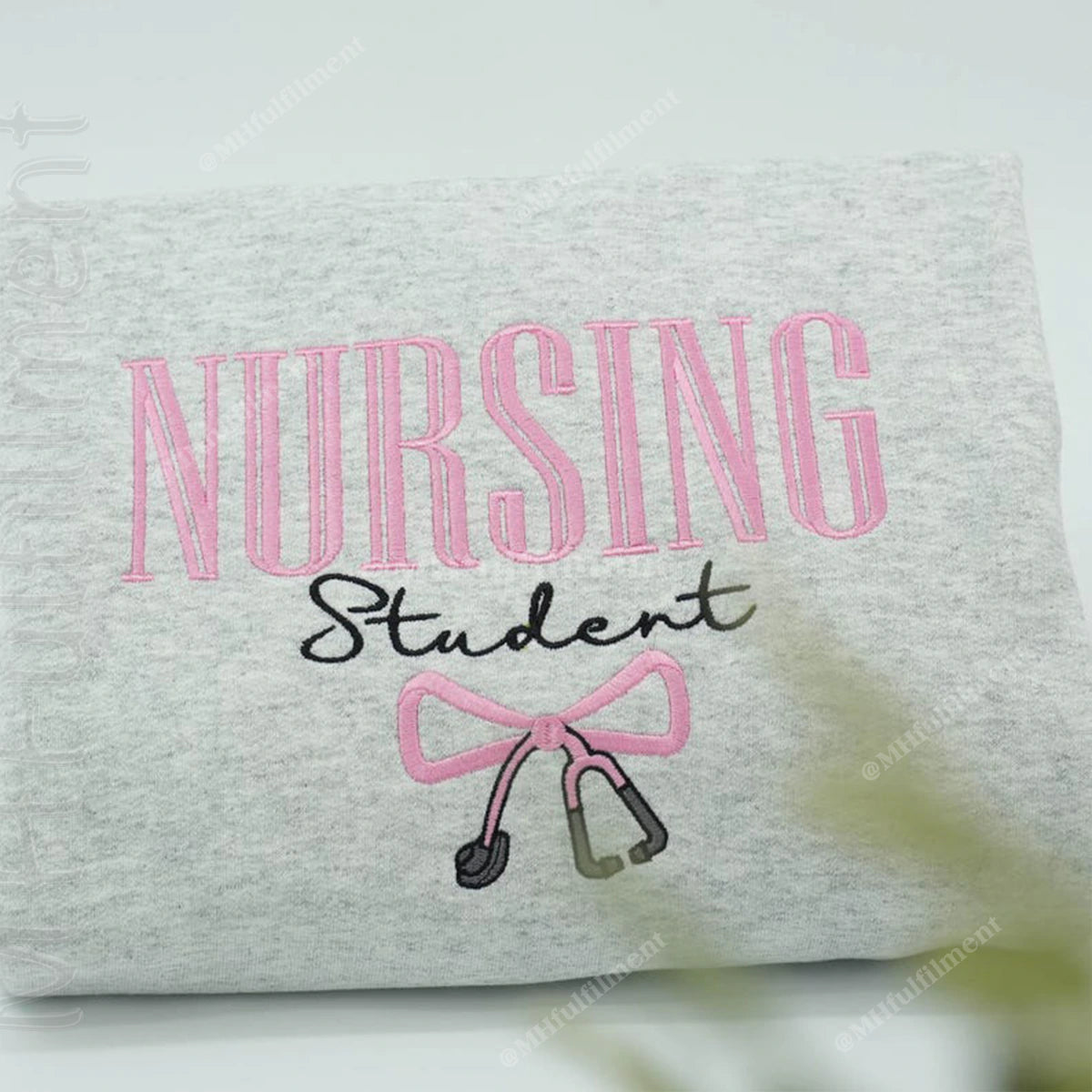 Gray sweatshirt with 'Nursing Student' text and stethoscope graphic on a white background
