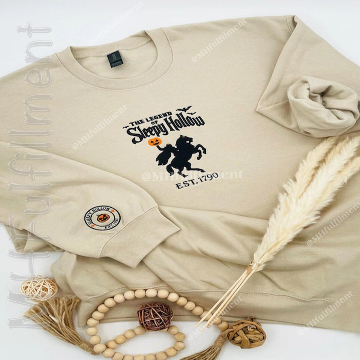 Beige sweatshirt with 'The Legend of Sleepy Hollow' design on a white background