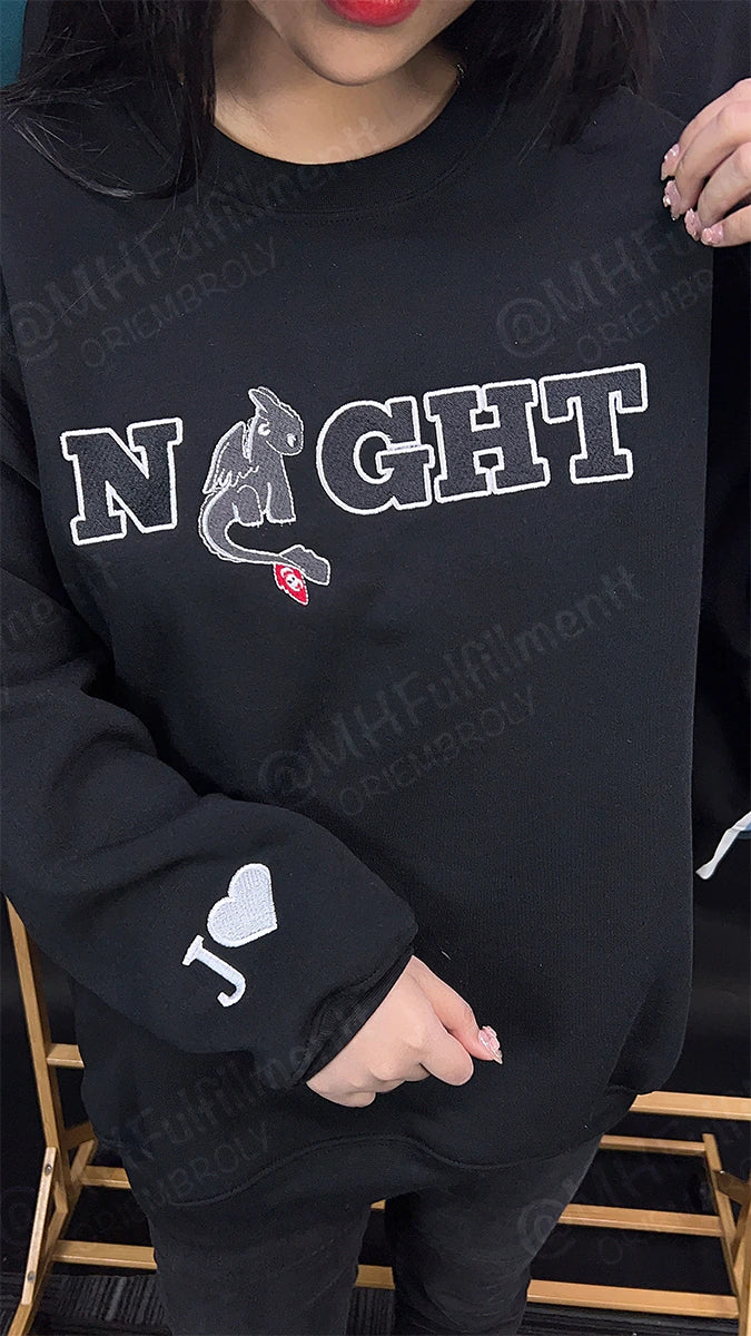 Detailed embroidery of Toothless and Light Fury
