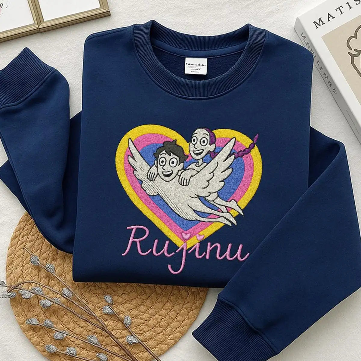 Navy blue sweatshirt with a heart design and 'Rujinu' text on a light surface.
