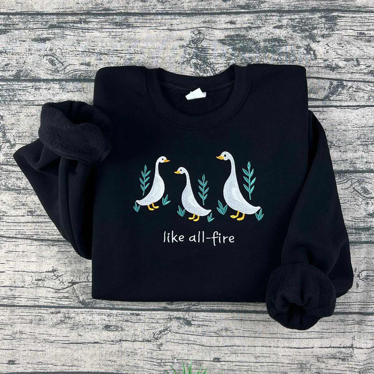 Like All Fire goose embroidered sweatshirt inspired by Hunger Games