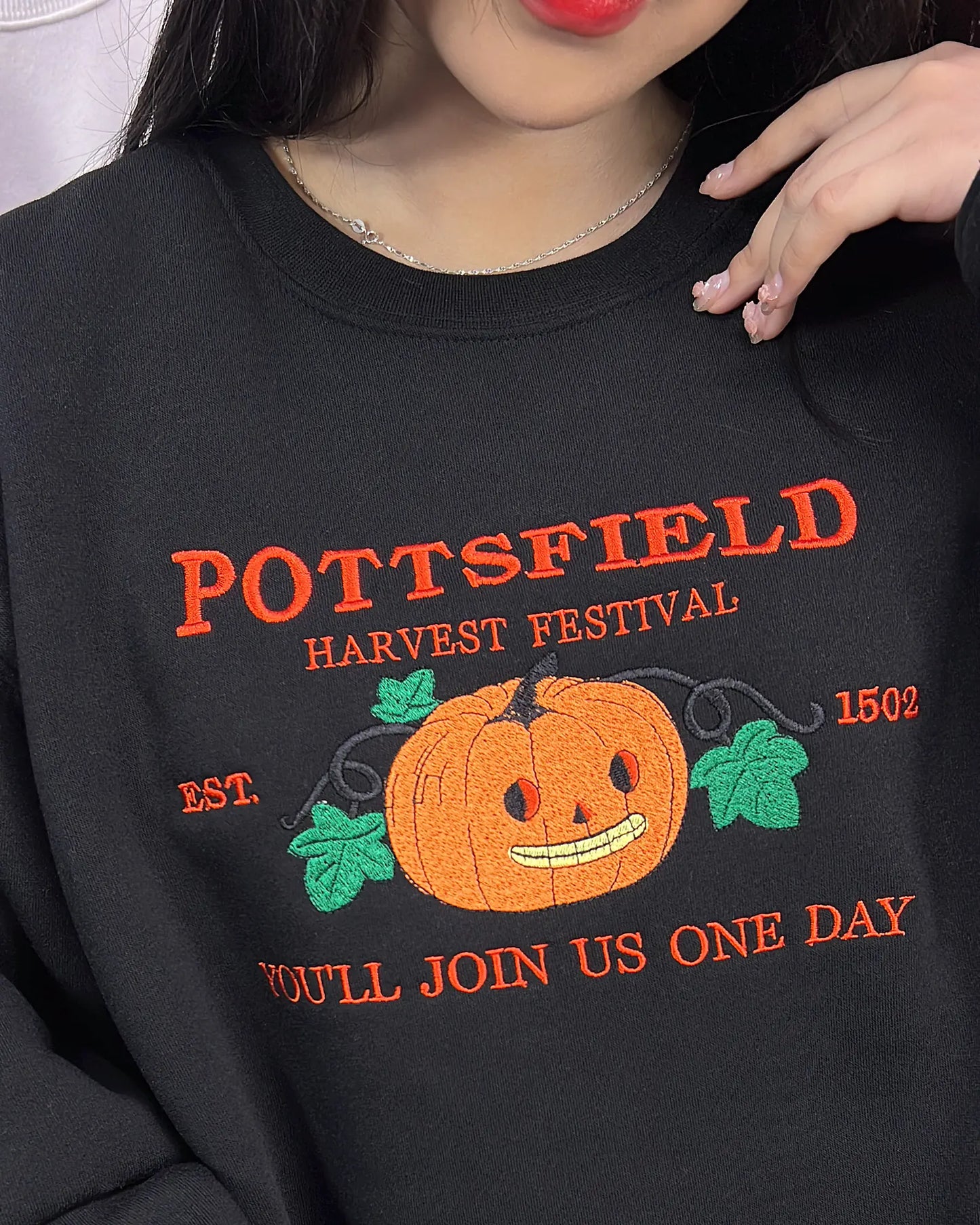 Embroidered Pottsfield Harvest Festival pumpkin carver sweatshirt with gothic skeleton pumpkin design for Halloween
