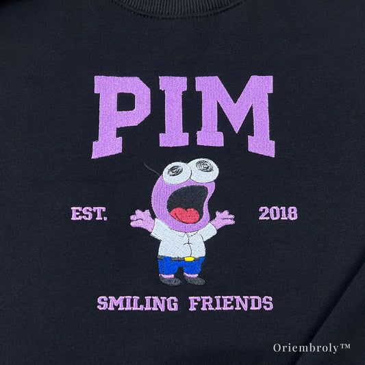 pink wide eyed cartoon embroidery close up