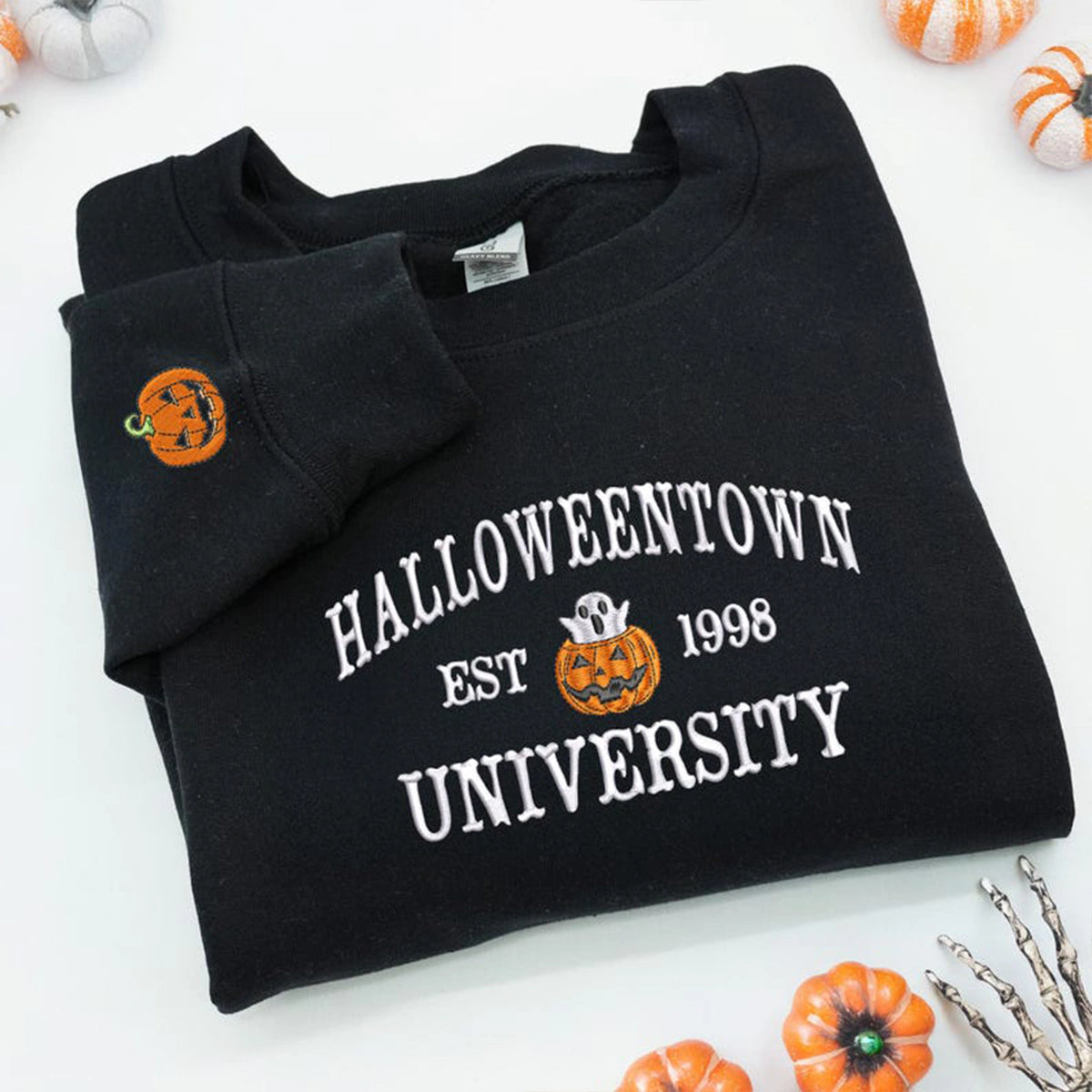 Black sweatshirt with 'Halloweentown University' text and pumpkins on a white background