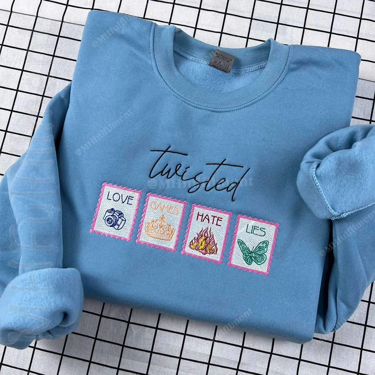 Blue sweatshirt with text and symbols on a grid background