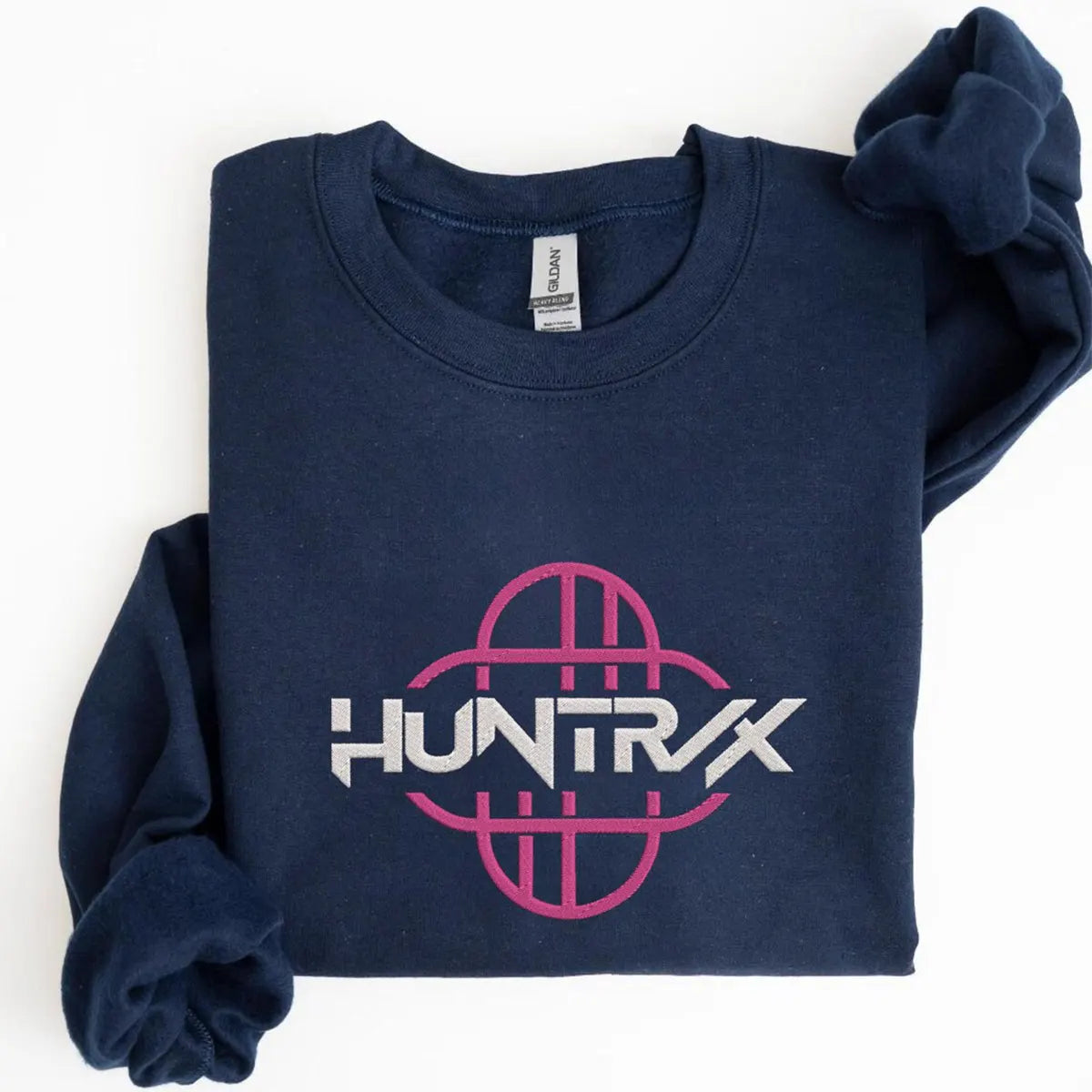 Folded navy blue sweatshirt with 'HUNTRX' logo on a white background