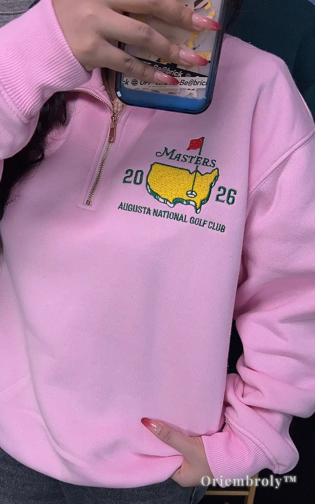 Light pink embroidered Masters quarter-zip from our spring golf collection. Breathable and cozy pullover featuring the 2026 Augusta National logo for a fresh, sporty look