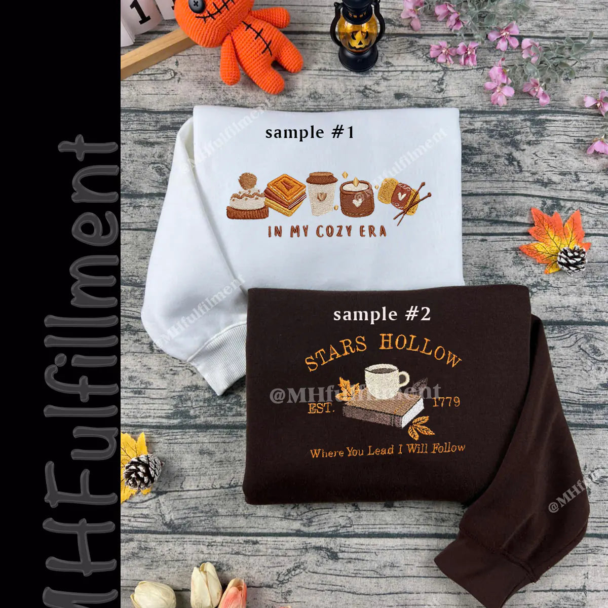 Two sweatshirts with printed designs on a wooden surface with decorative items.