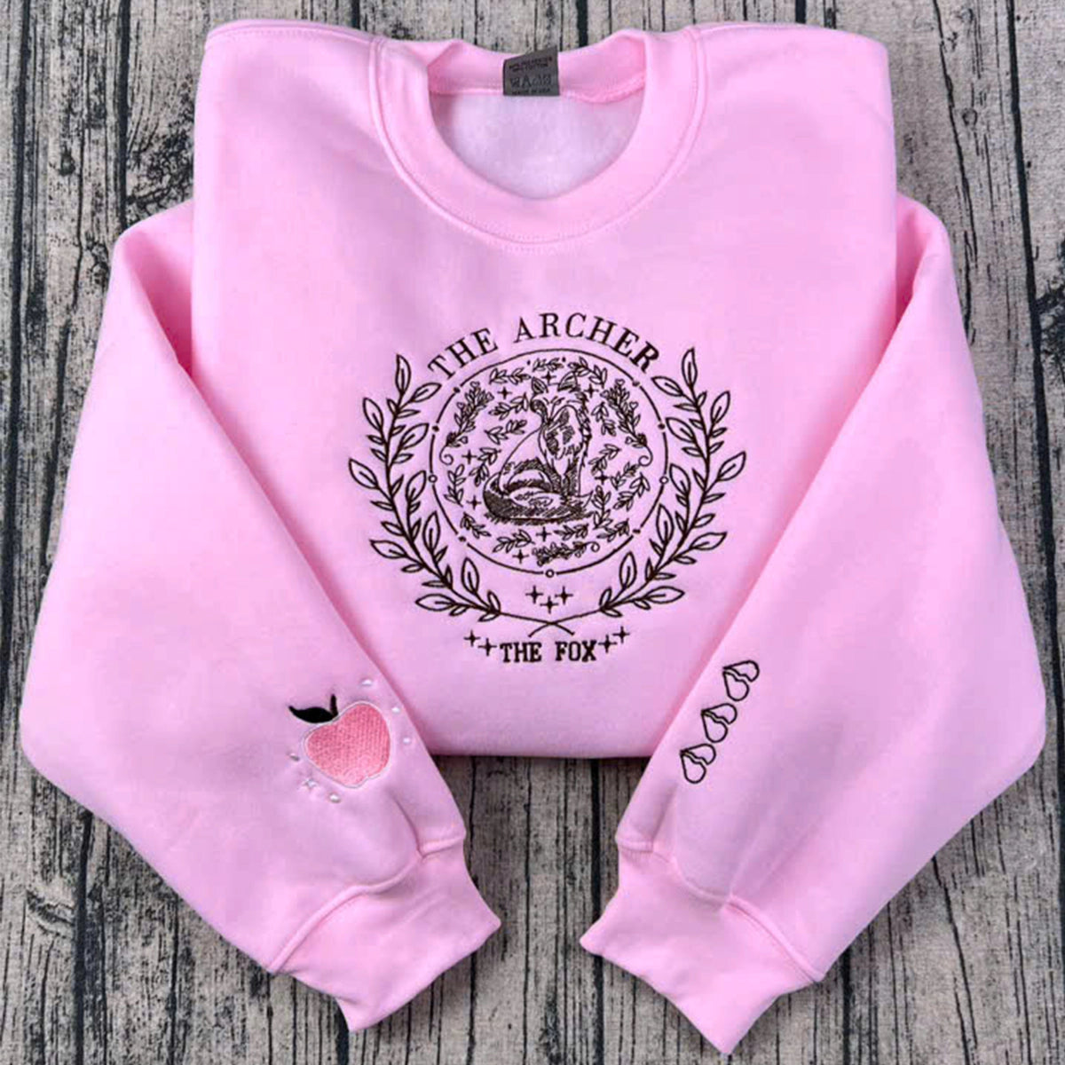 The Archer and The Fox embroidered sweatshirt, Once Upon A Broken Heart hoodie, and Jack's Apple sweatshirt β perfect bookish shirts for fantasy lovers.