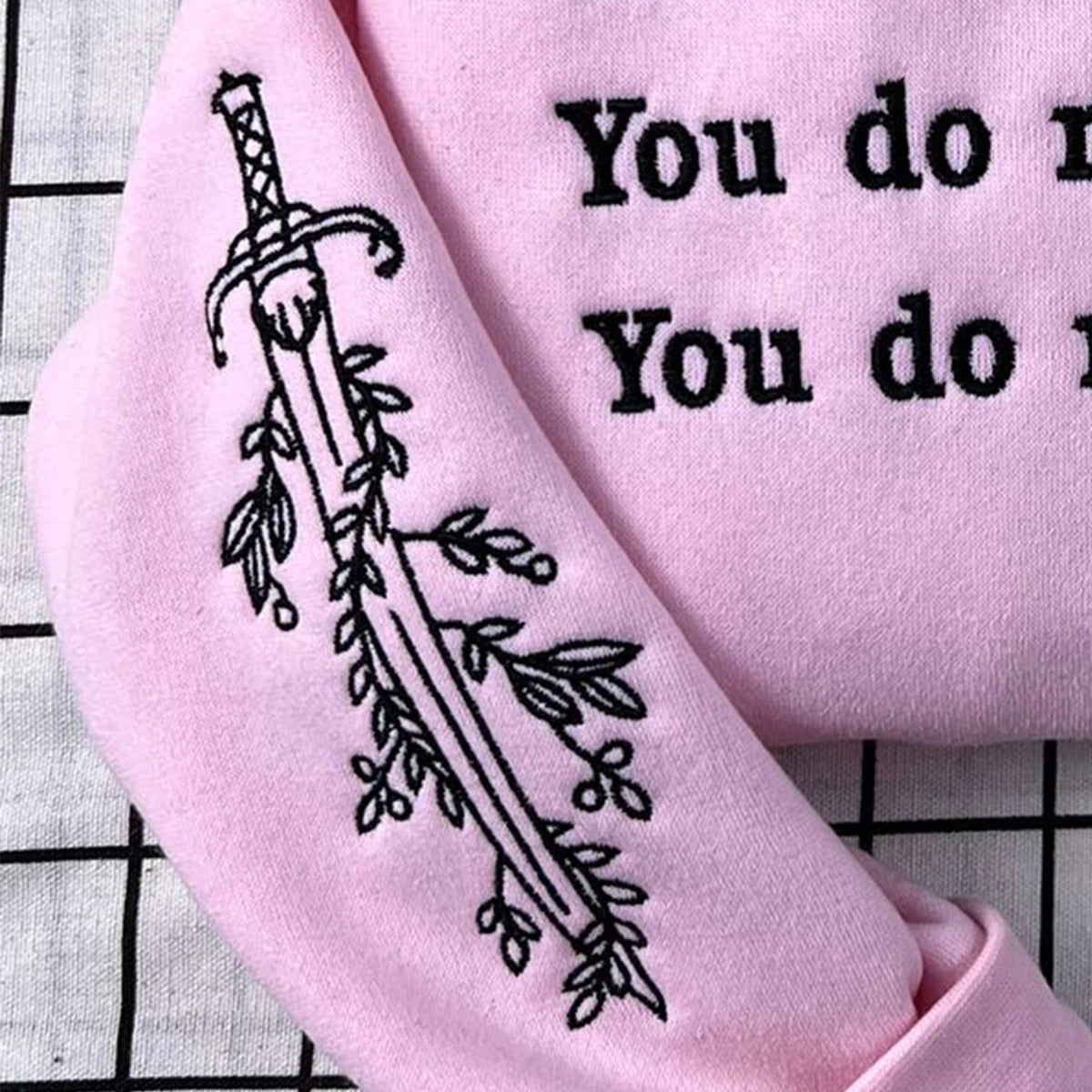 Bookish hoodie featuring You Do Not Yield quote from TOG series, perfect for fans of fantasy merch.