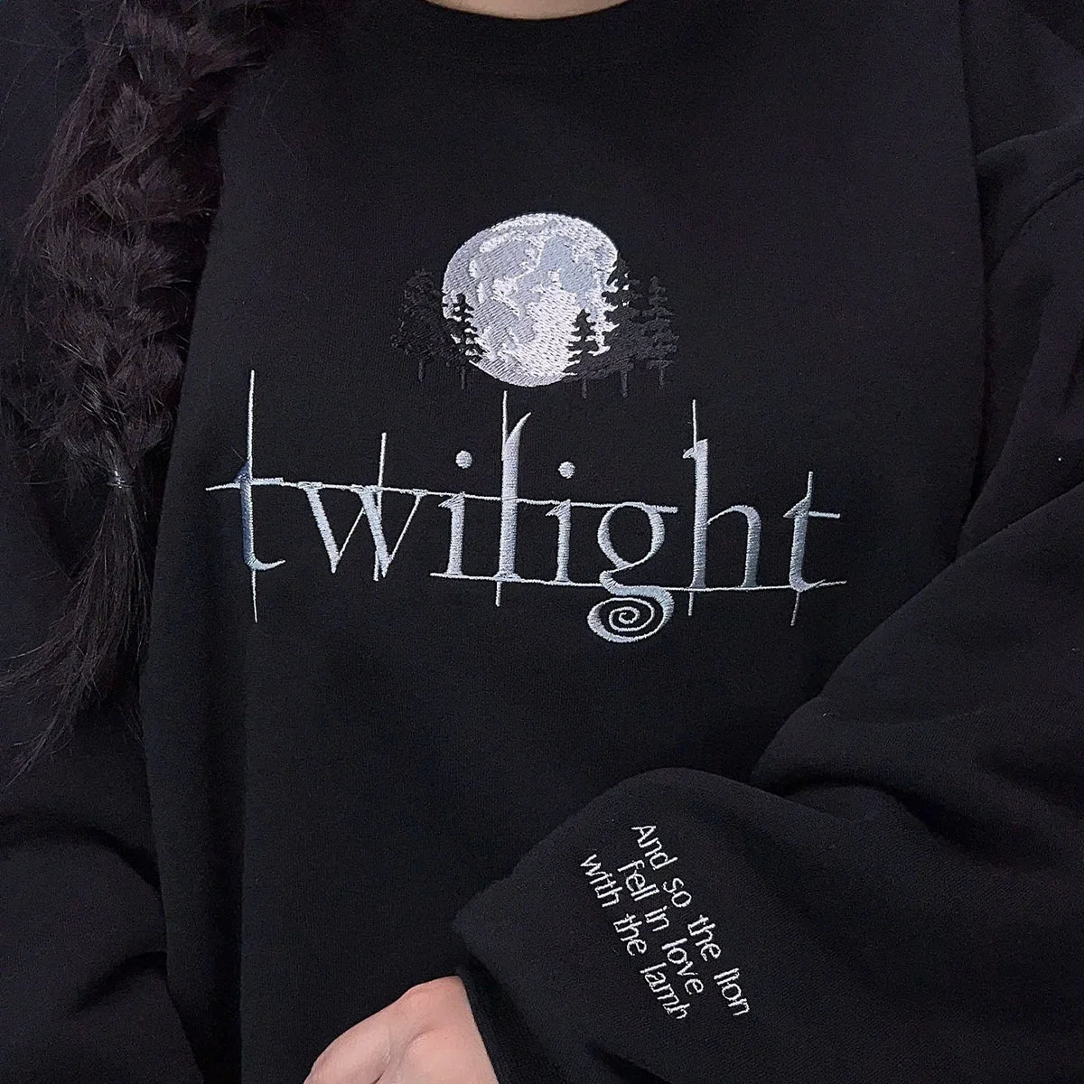 Black sweatshirt with 'twilight' design and moon and trees graphic.