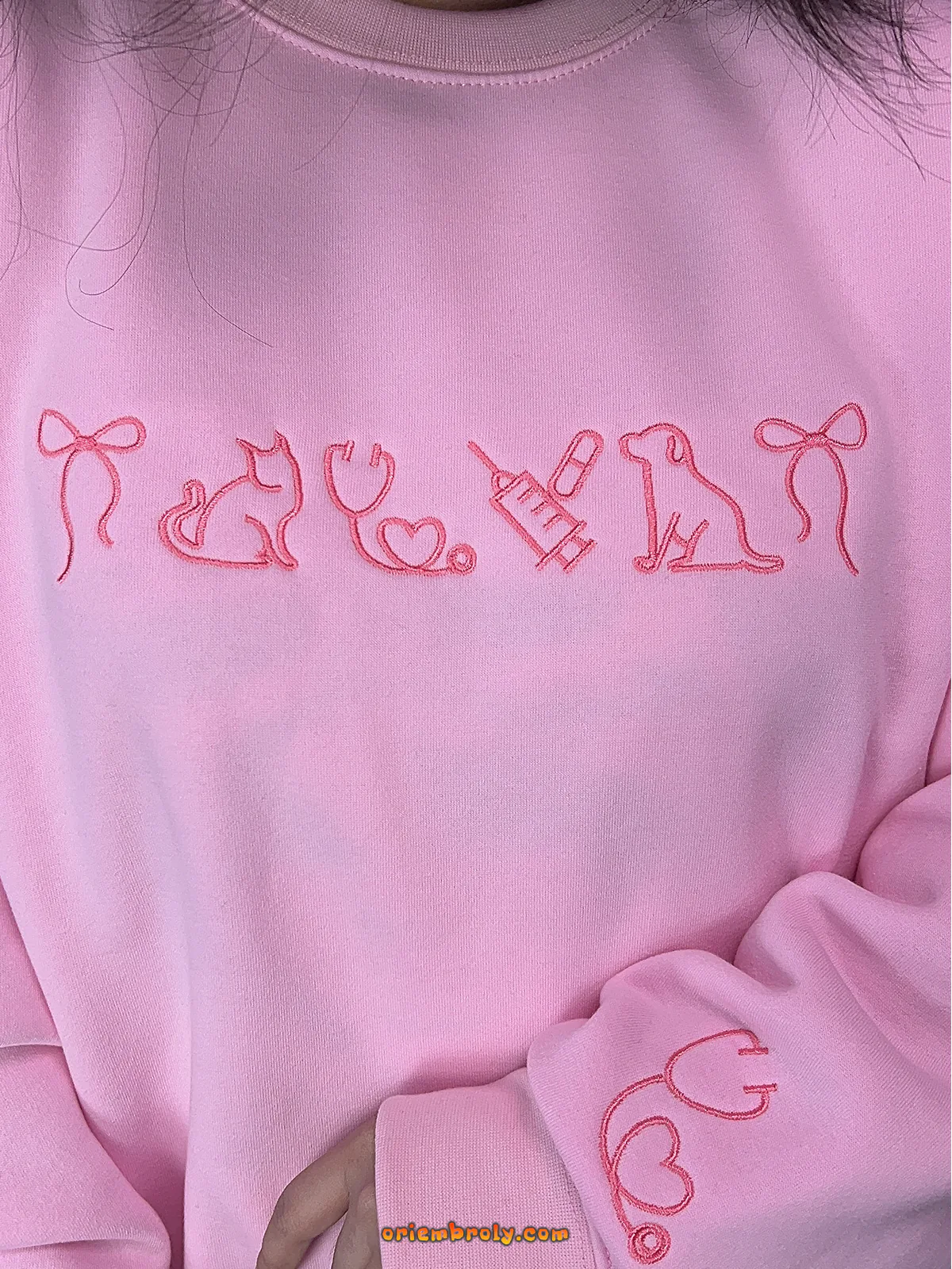 Cute animal lover sweatshirt in pink with stethoscope and pet embroidery — ideal for clinic wear or casual days.