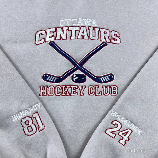 close up of vintage hockey crest embroidery with crossed sticks