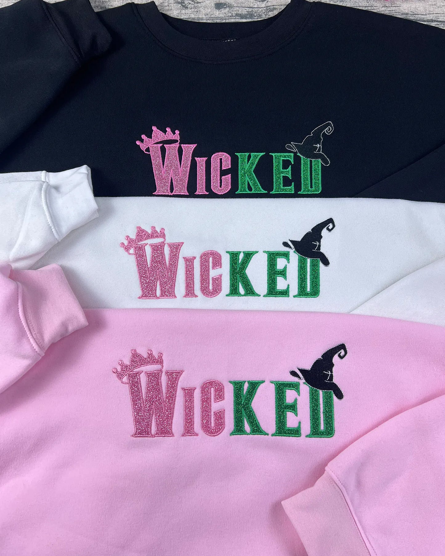Wicked movie merchandise hoodie with embroidery quote