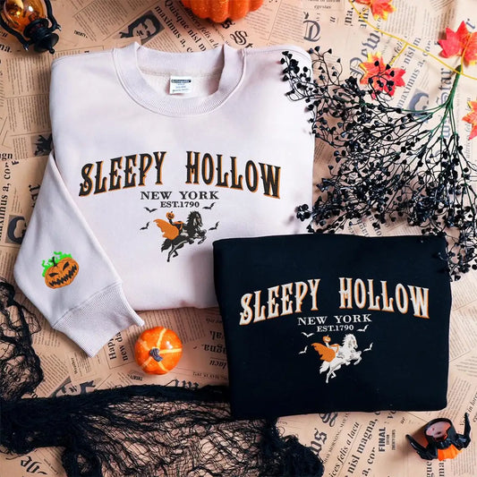 White and black sweatshirts with 'Sleepy Hollow New York' design on a newspaper background.