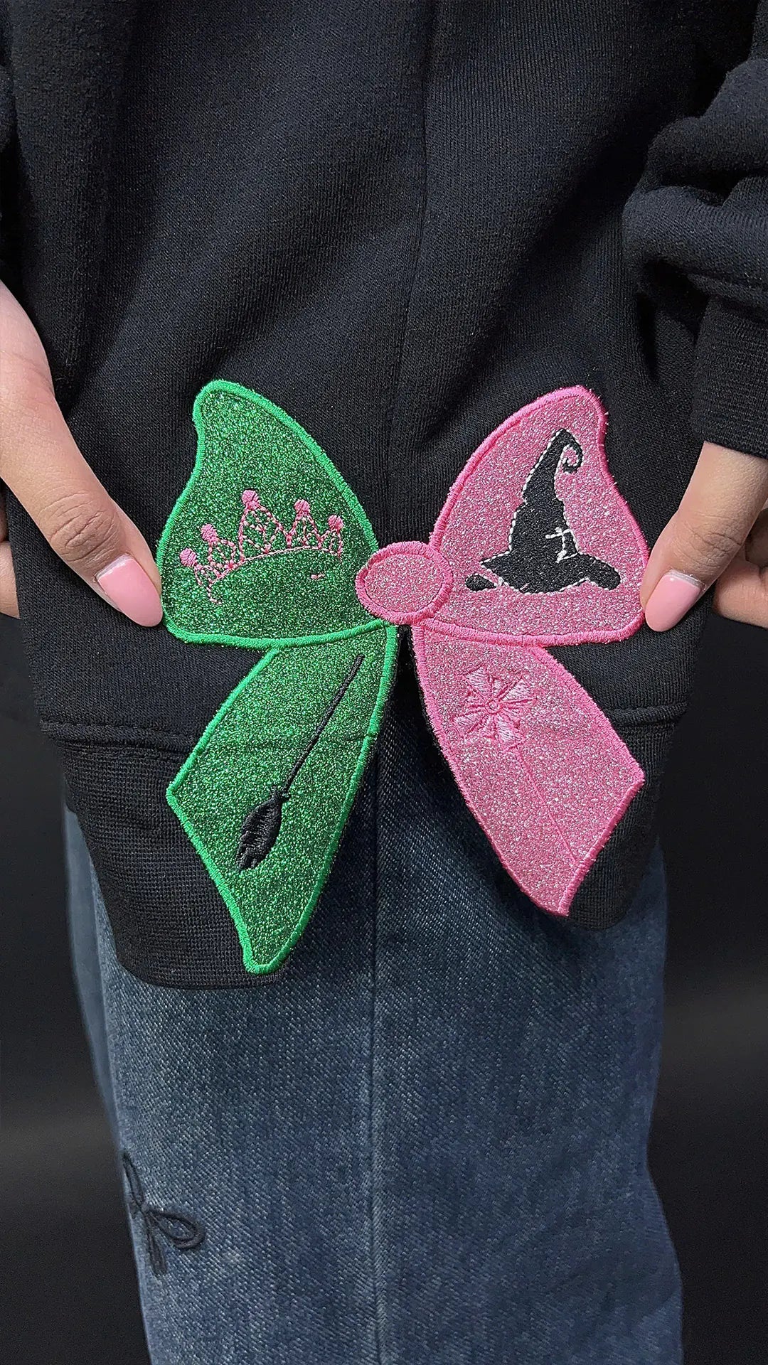 Wizard of Oz inspired Wicked movie hoodie – unique embroidered sweatshirt for theater enthusiasts and musical collectors.