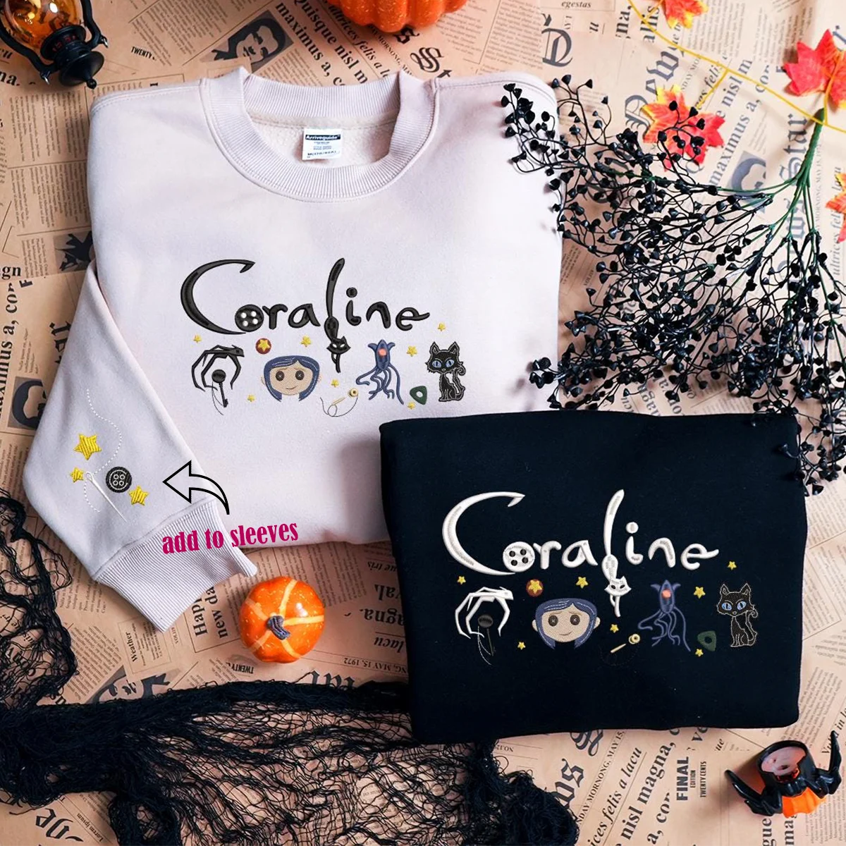 White and black sweatshirts with 'Coraline' design on a newspaper background