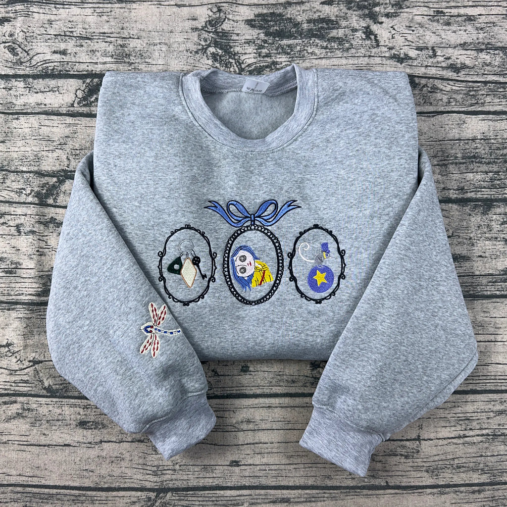 Coraline Embroidered Sweatshirt – Fantasy Keys, Coraline Doll, Cat & Dragonfly Embroidery, Spooky Cute Movie Merch Crewneck