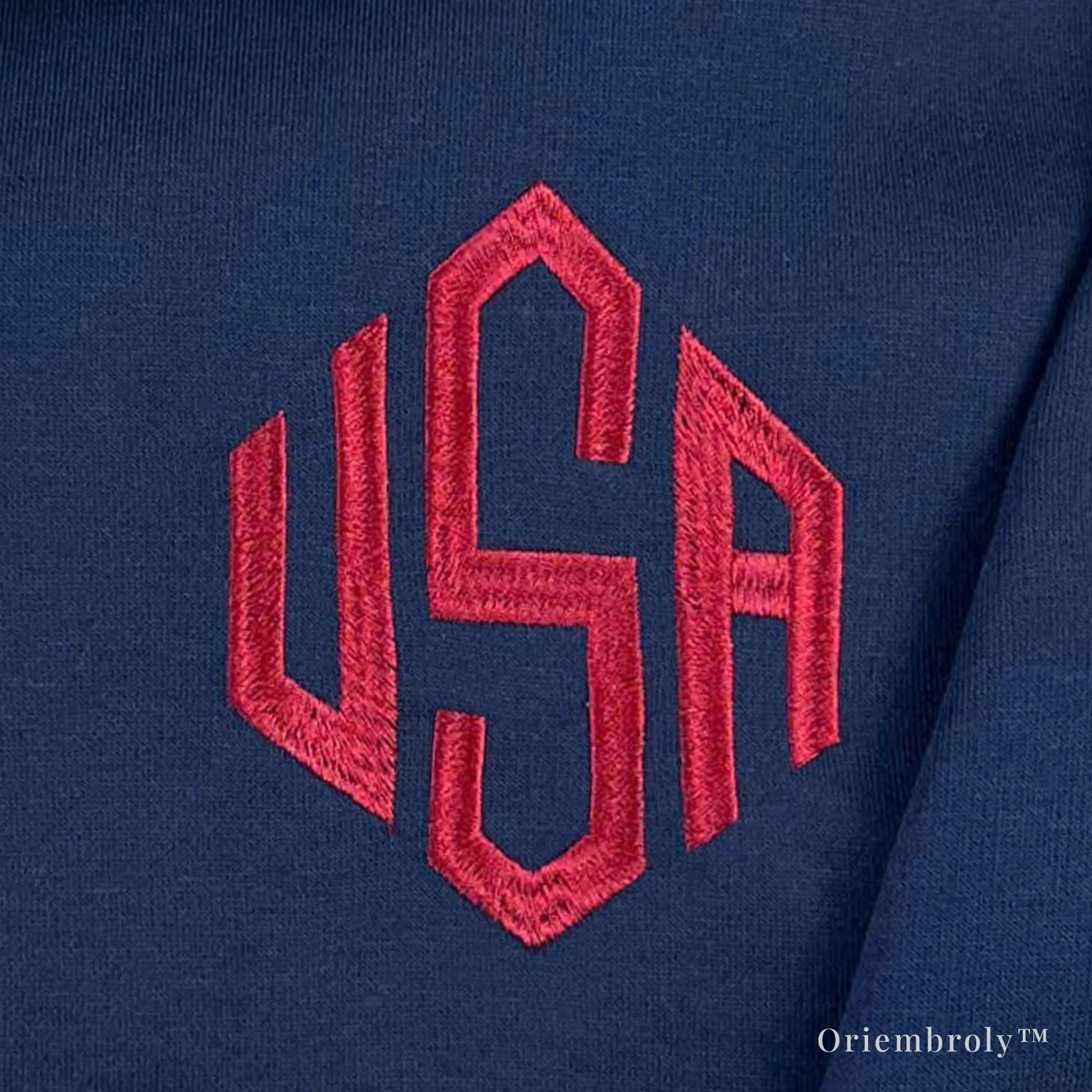 close-up of 3 letter embroidery on quarter zip sweatshirt