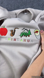Chihuahua Rebus Puzzle Sweater - Apple Sax Mountain Burrito