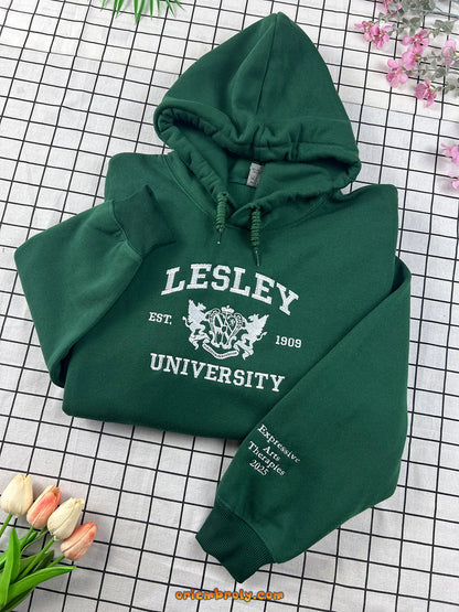 Green hoodie with 'Lesley University' text on a grid background