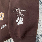 Custom embroidered hoodie featuring a pet’s paw print design.