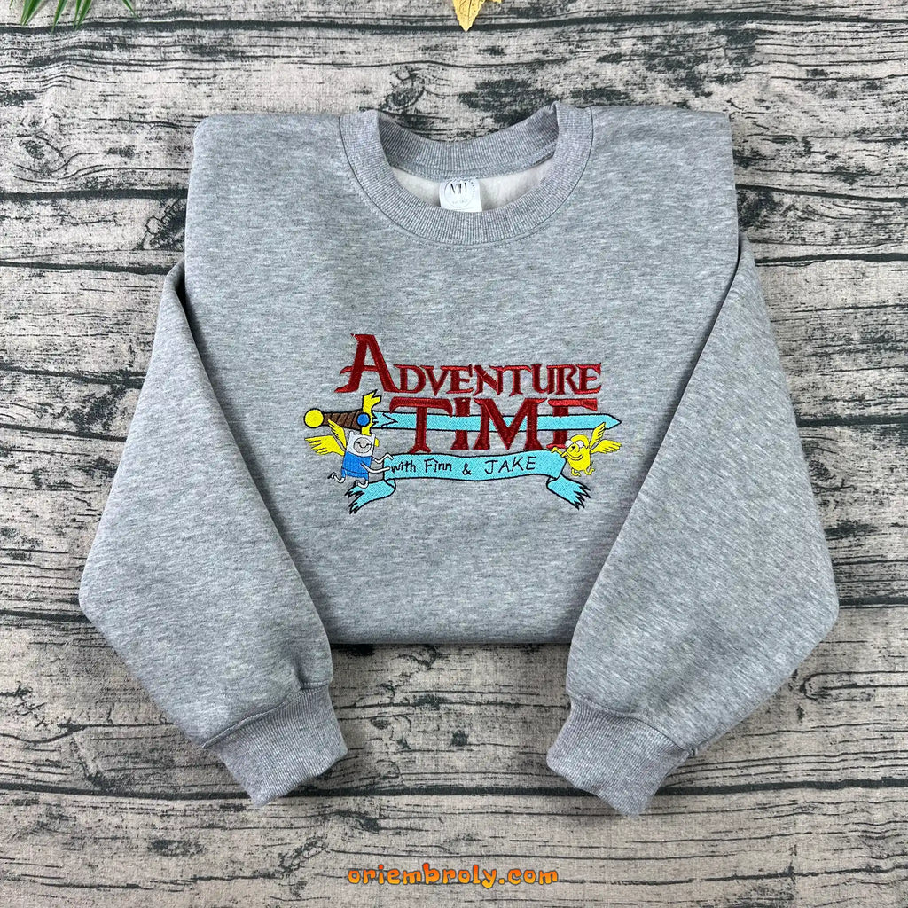 Colorful Adventure Time embroidery with flying Finn and Jake
