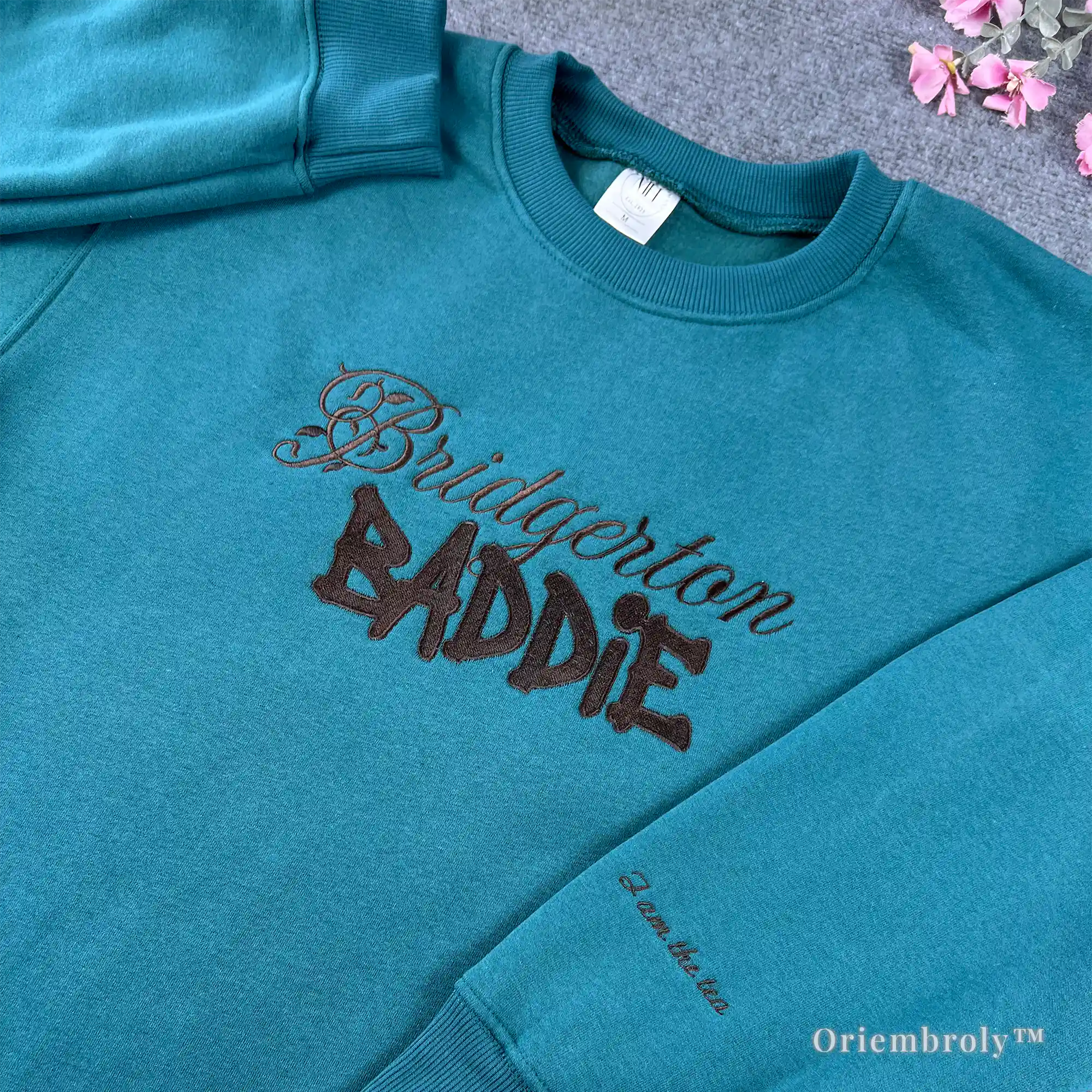 Aesthetic Bridgerton merch: Teal crewneck sweater featuring "Bridgerton Baddie" embroidery