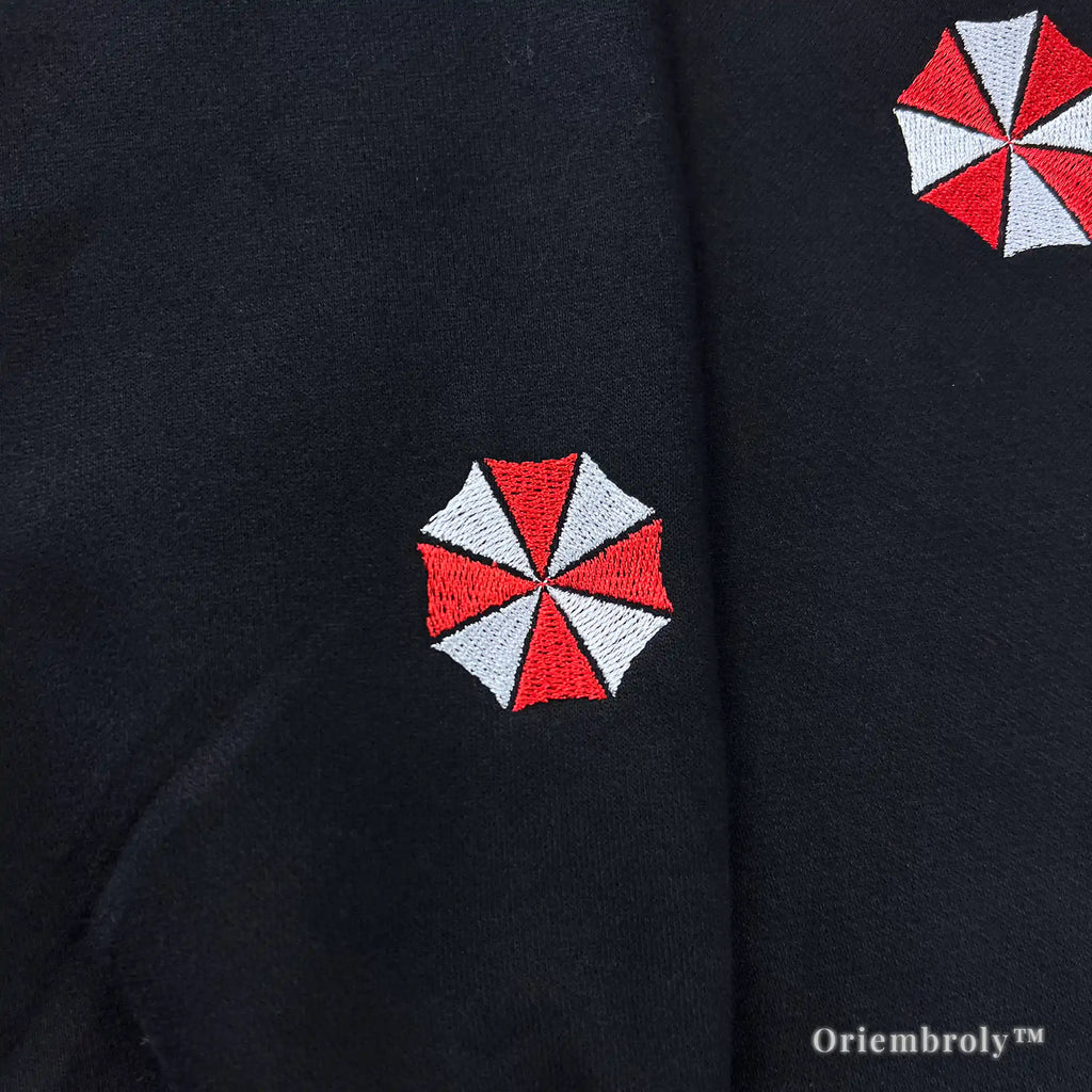 Aesthetic Umbrella Corporation black streetwear hoodie with detailed embroidery and biohazard symbols