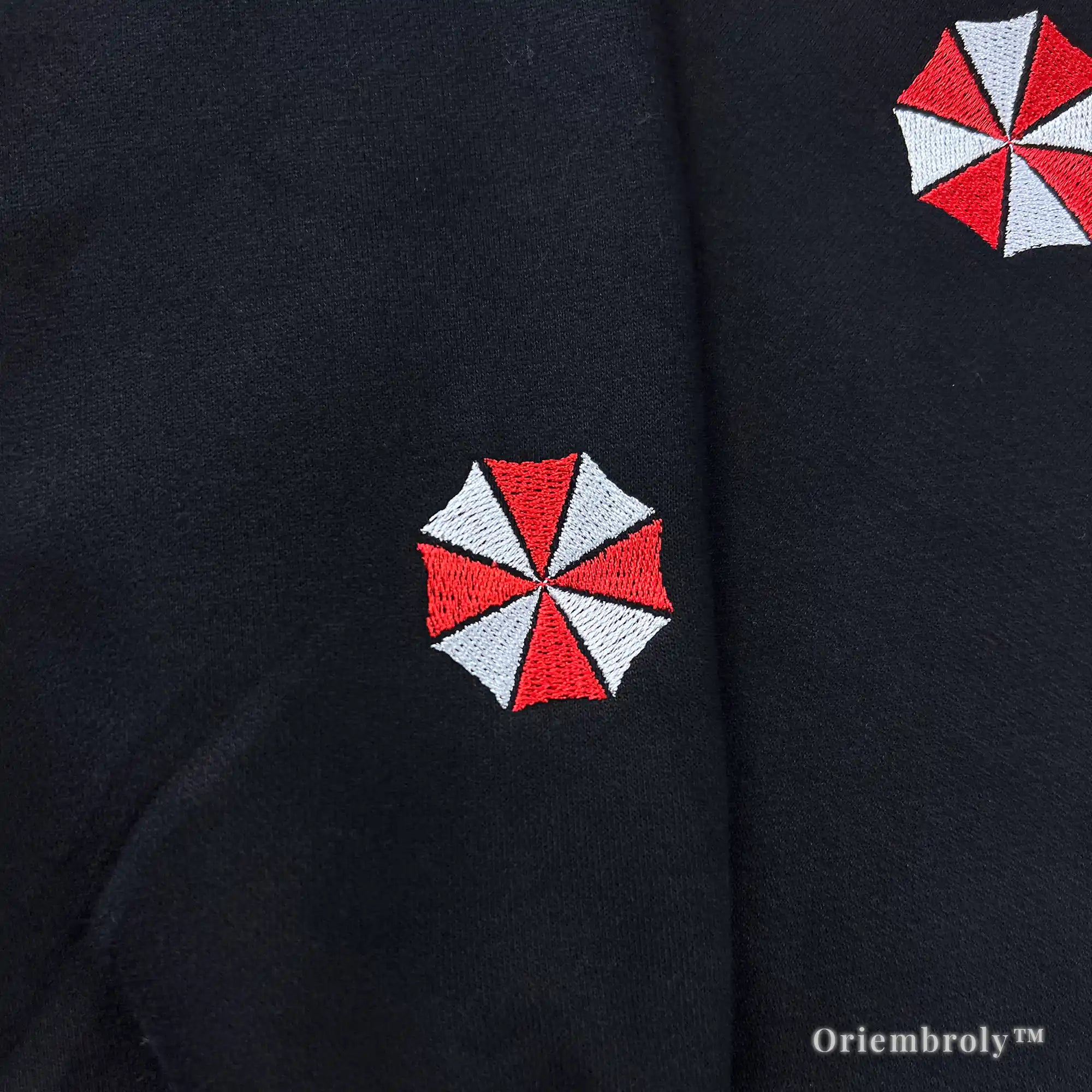 Aesthetic Umbrella Corporation black streetwear hoodie with detailed embroidery and biohazard symbols