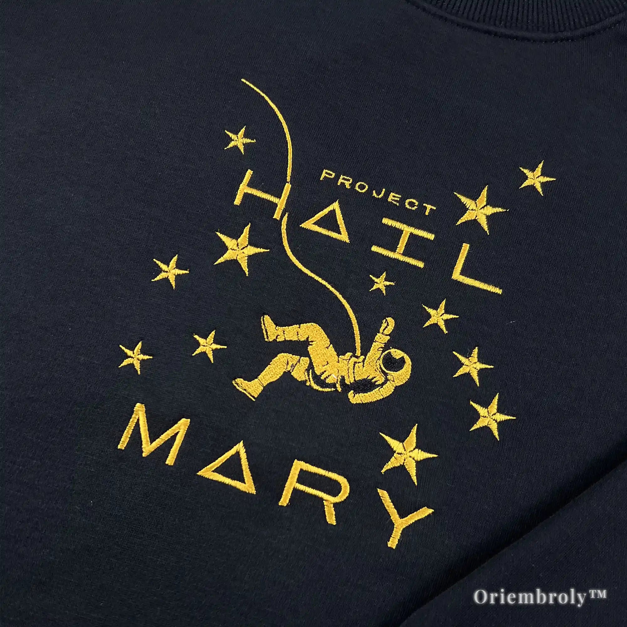 Officially inspired Project Hail Mary merch: a premium black pullover with high-density yellow satin stitch embroidery of a floating astronaut and stars. A must-have for Andy Weir fans
