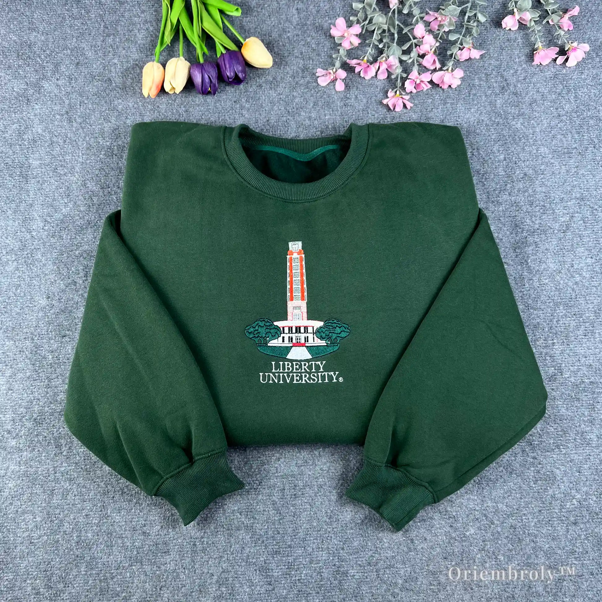 Forest green Auburn University sweatshirt featuring Samford Hall clock tower embroidery