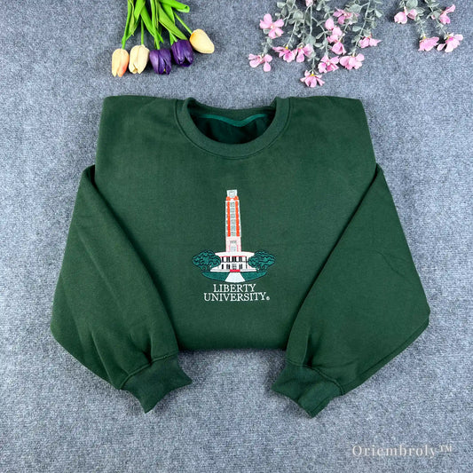 Forest green Auburn University sweatshirt featuring Samford Hall clock tower embroidery