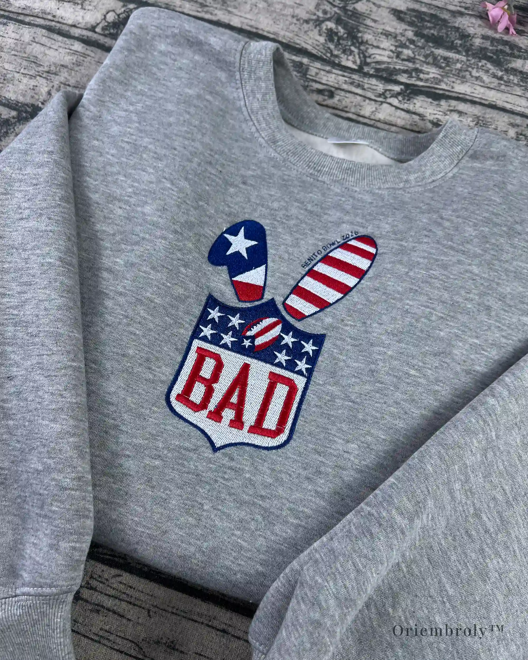 Shield-style BAD logo embroidery with red white blue colors
