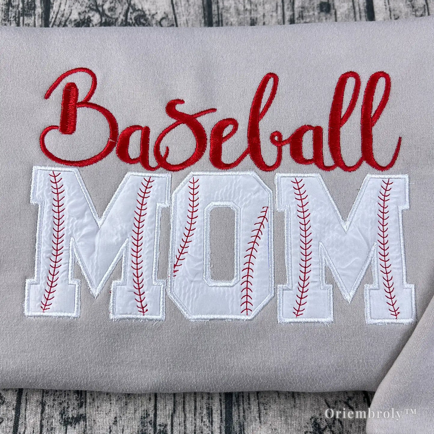 close up applique MOM lettering with red baseball stitching