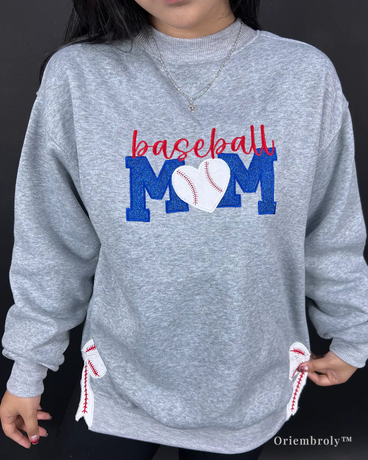woman wearing embroidered baseball mom sweatshirt outdoors